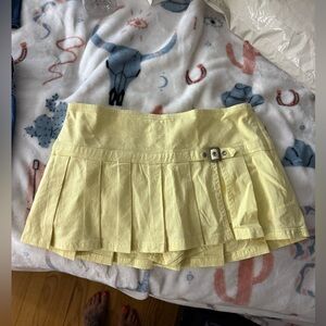 BDG Pale Yellow Pleated Mini Skort with Side Buckle